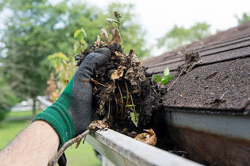 Cleaning debris out of a gutter